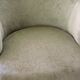 Toad in almond green velvet armchair on castors