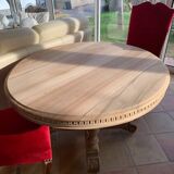 Oval solid walnut dining table on central leg with 4 extensions, 12/15 people