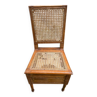 Wicker chair with opening seat