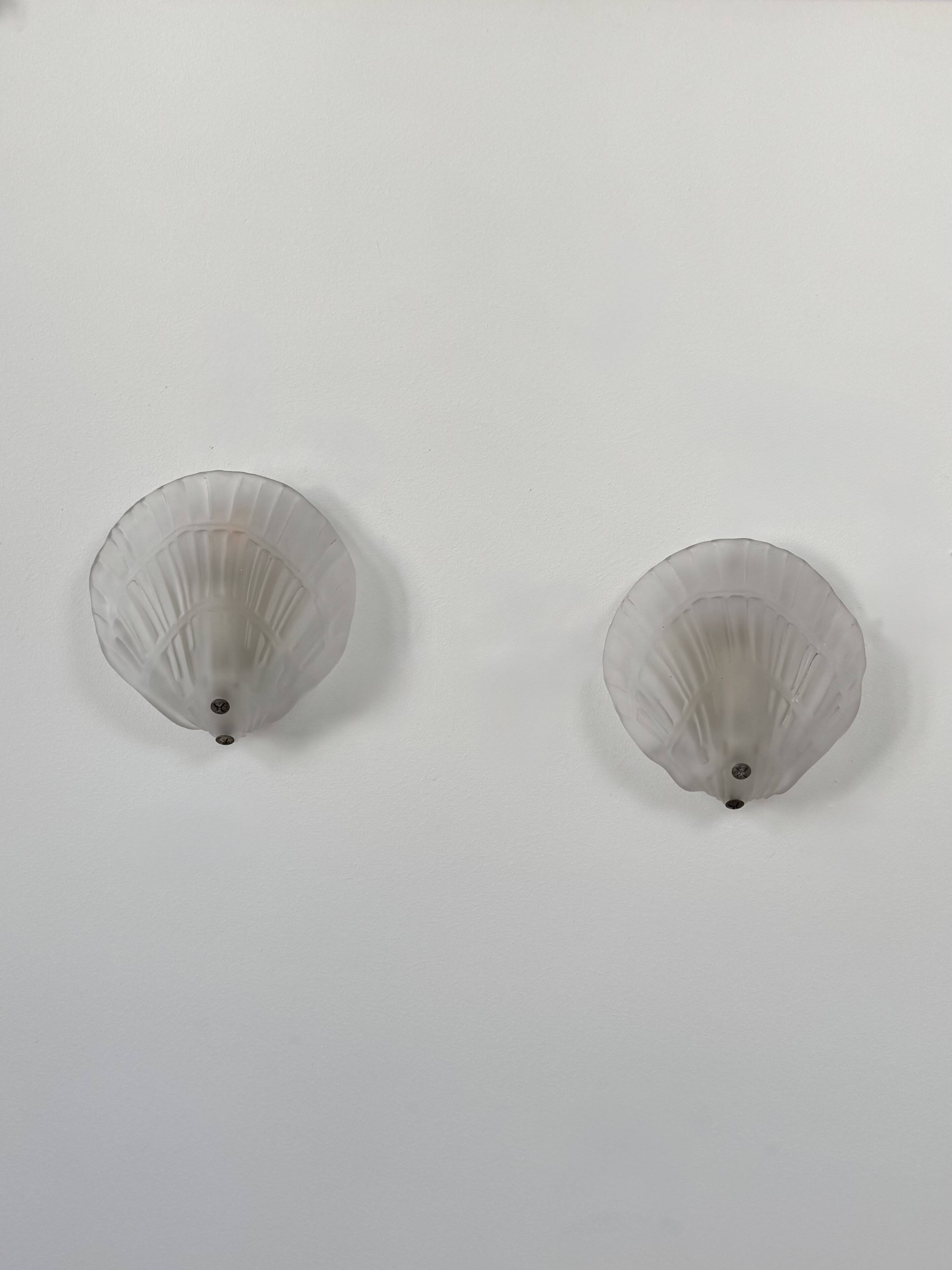 Pair of shell wall lights, frosted glass, France, 1970.