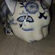 Vintage white and blue porcelain lying cat
