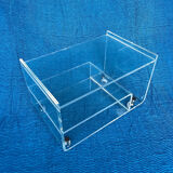 Translucent plexiglass storage drawer/cabinet on wheels.