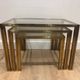 Set of 3 nesting tables in brass and glass. French work by Guy Lef.