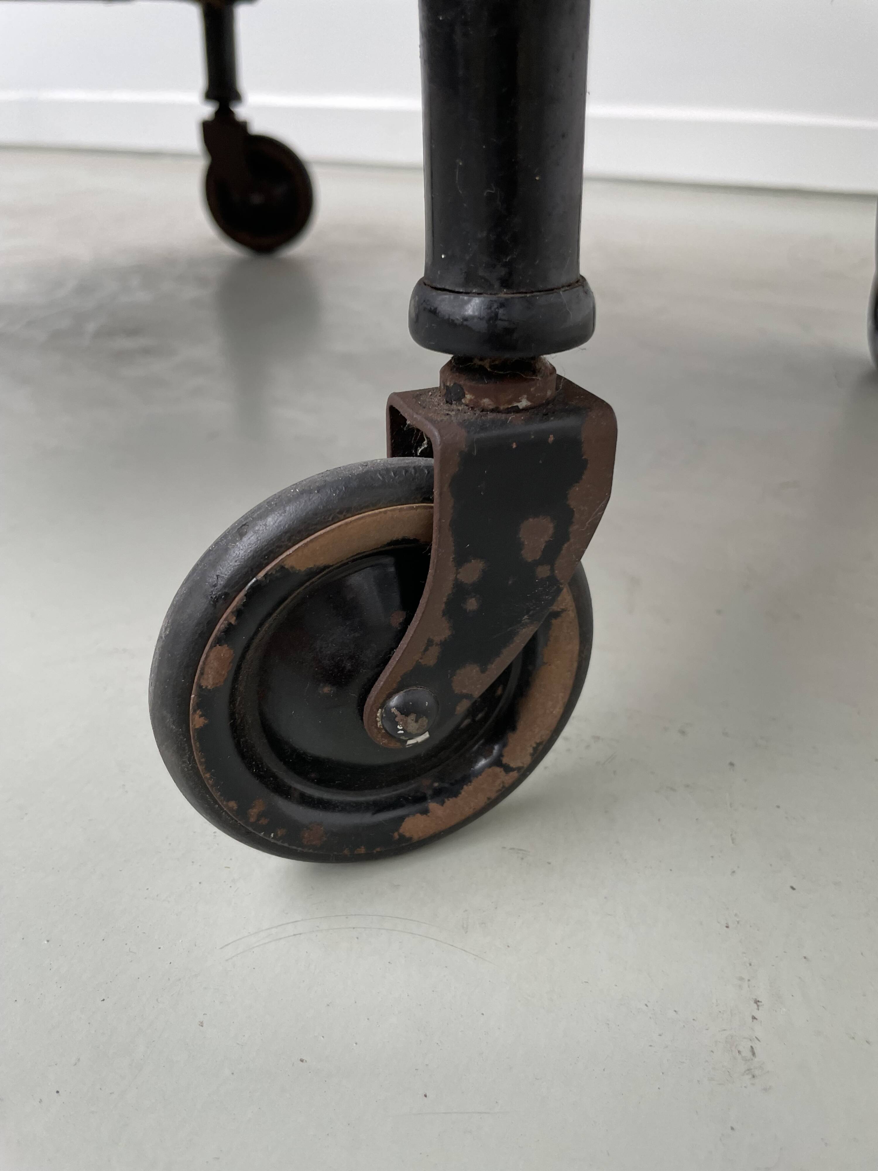 Perforated metal serving trolley in the Mathieu Matégot style