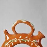 Circular glazed terracotta gargoulette