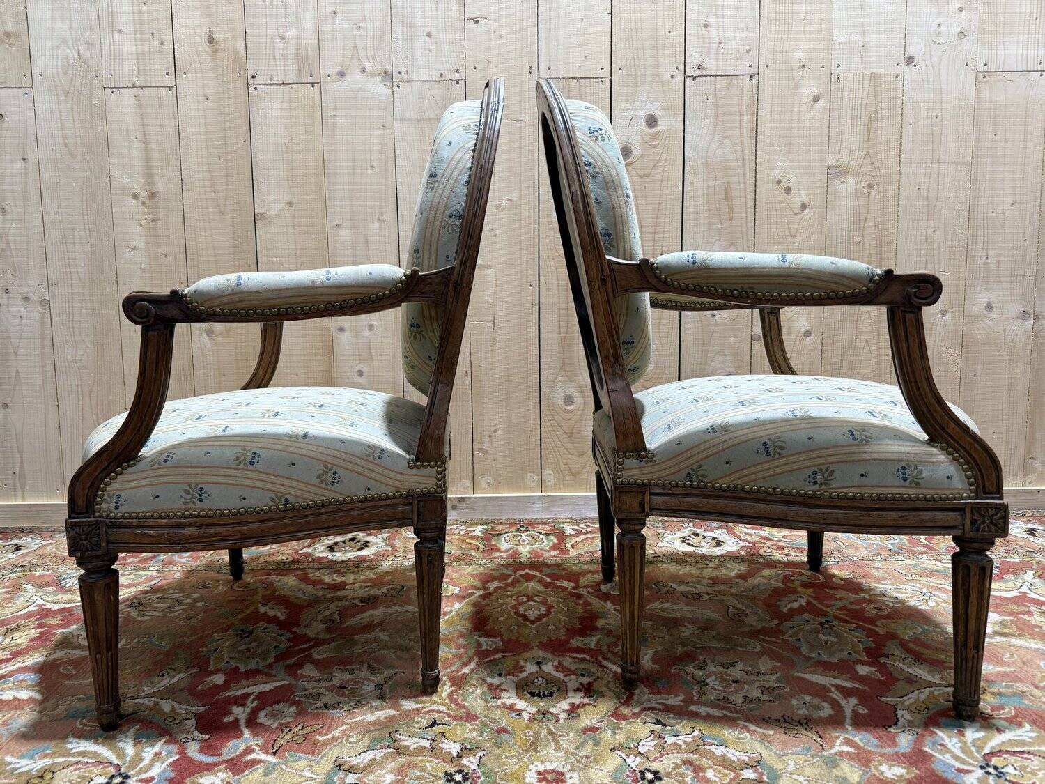 Pair of cabriole armchairs with medallion backs from the Louis XVI period, stamped OT.