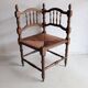 Antique corner chair "fireplace corner" in turned wood and straw.