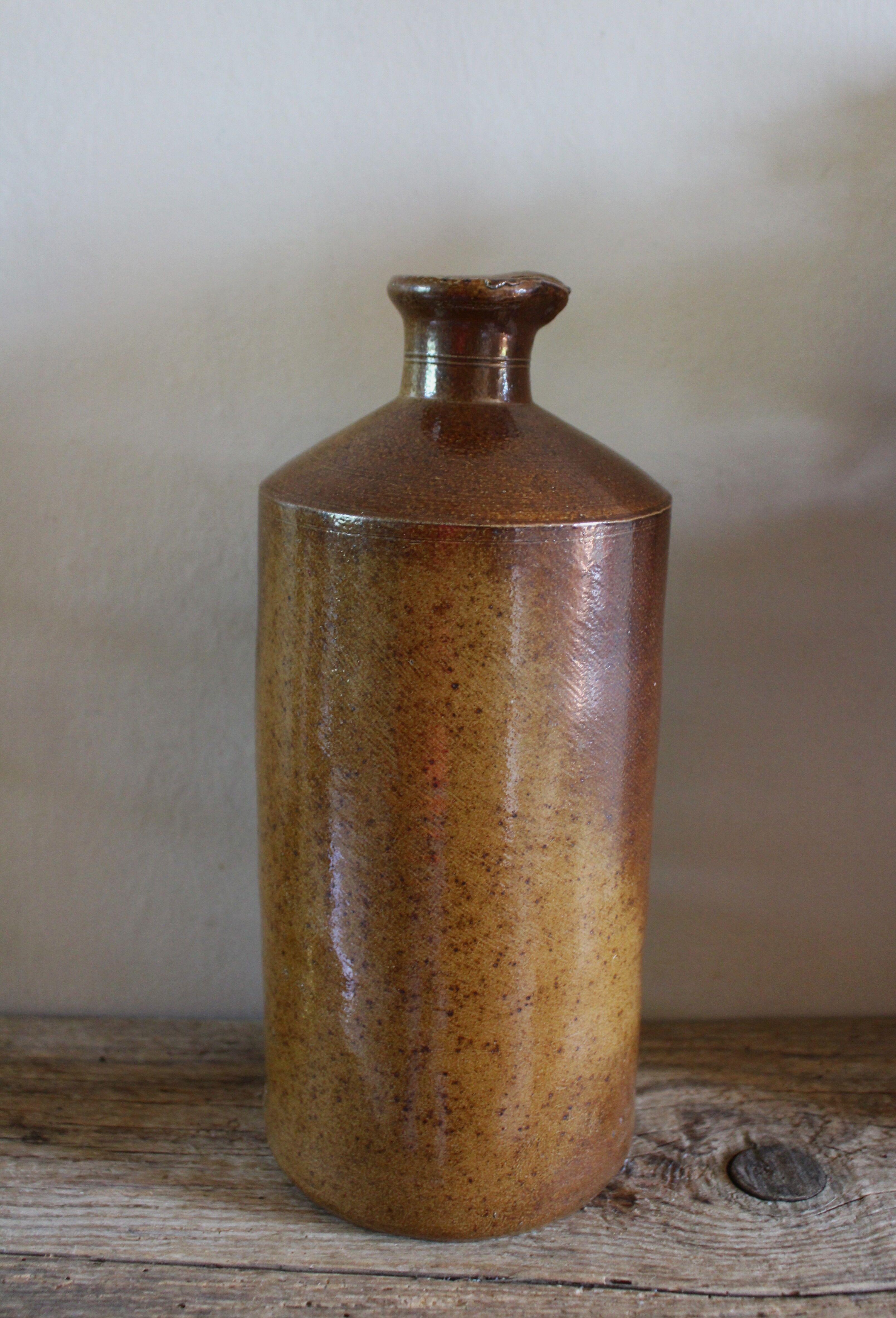 Vintage Bourne Deney stoneware liqueur bottle with pouring spout.