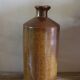 Vintage Bourne Deney stoneware liqueur bottle with pouring spout.