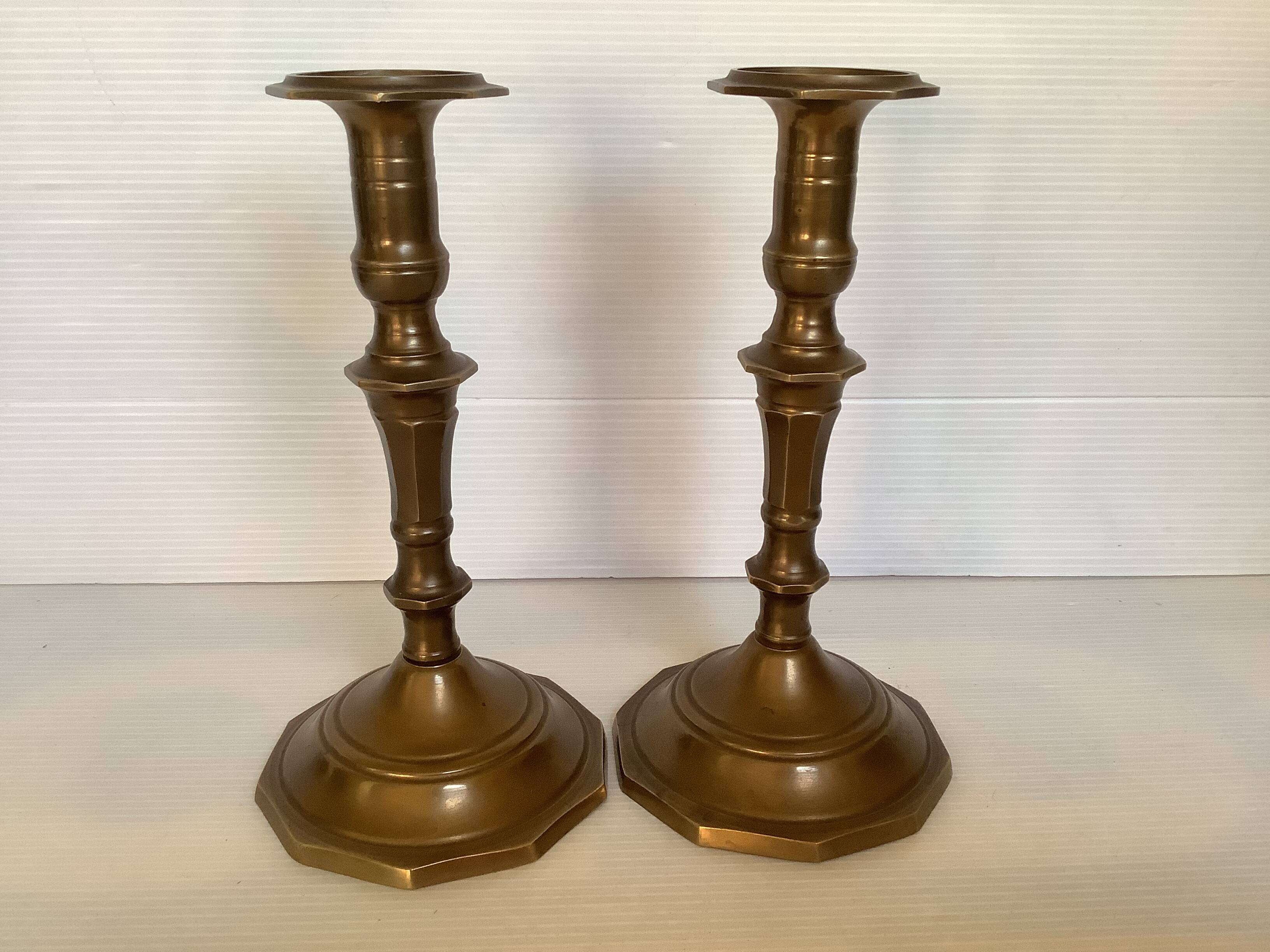 Four brass candle holders