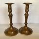 Four brass candle holders