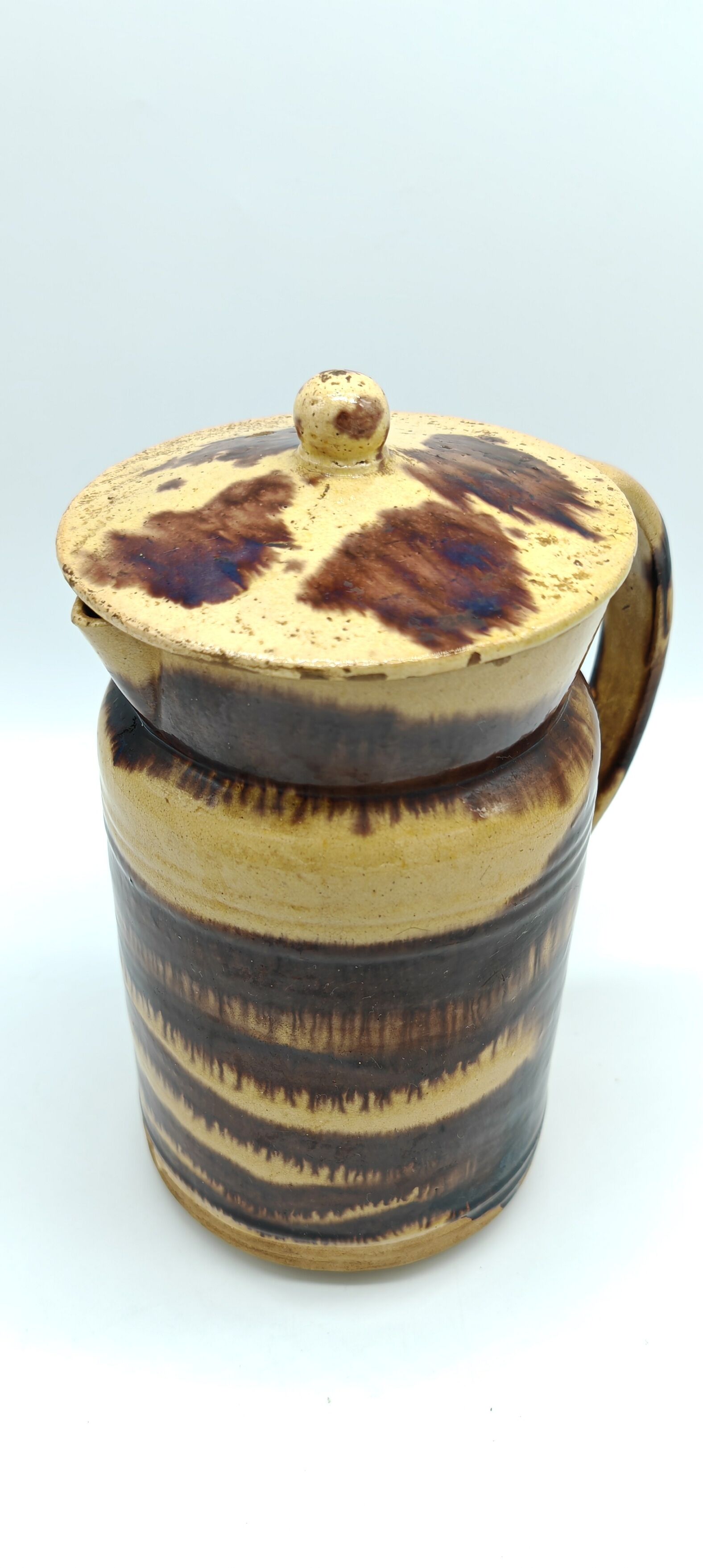 Pitcher covered in glazed earth old french tabby dishes