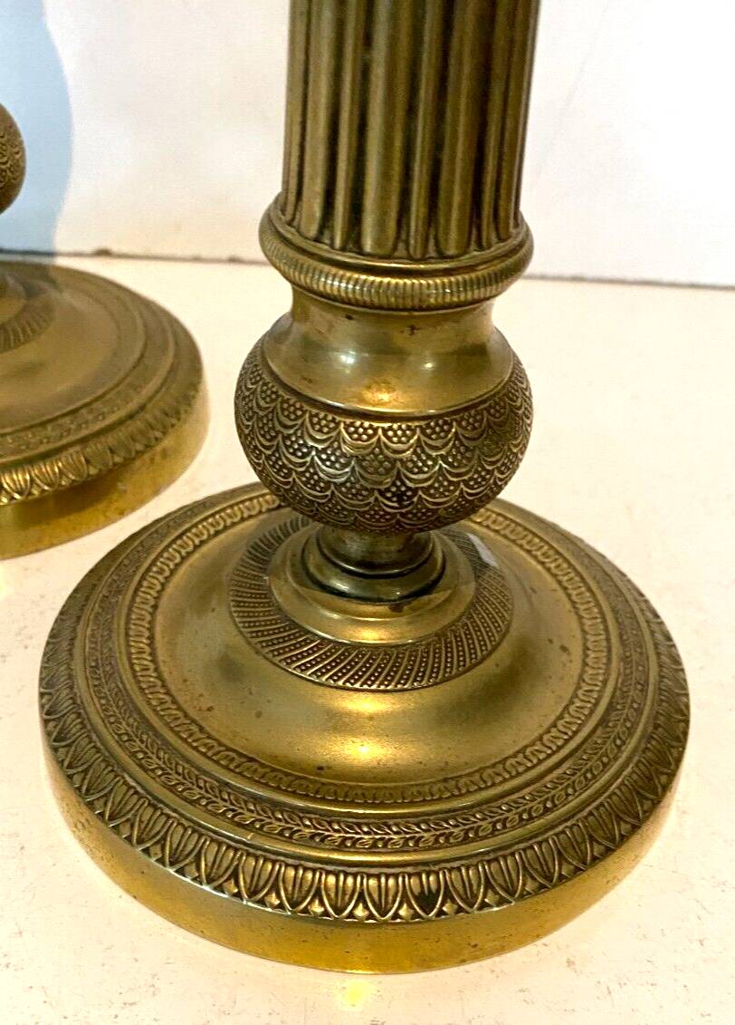 Pair of Louis XVI style candlesticks in 19th century chiseled bronze