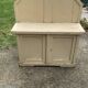 Small vintage yellow bench made of hand-painted wood, low storage from the 1920s.