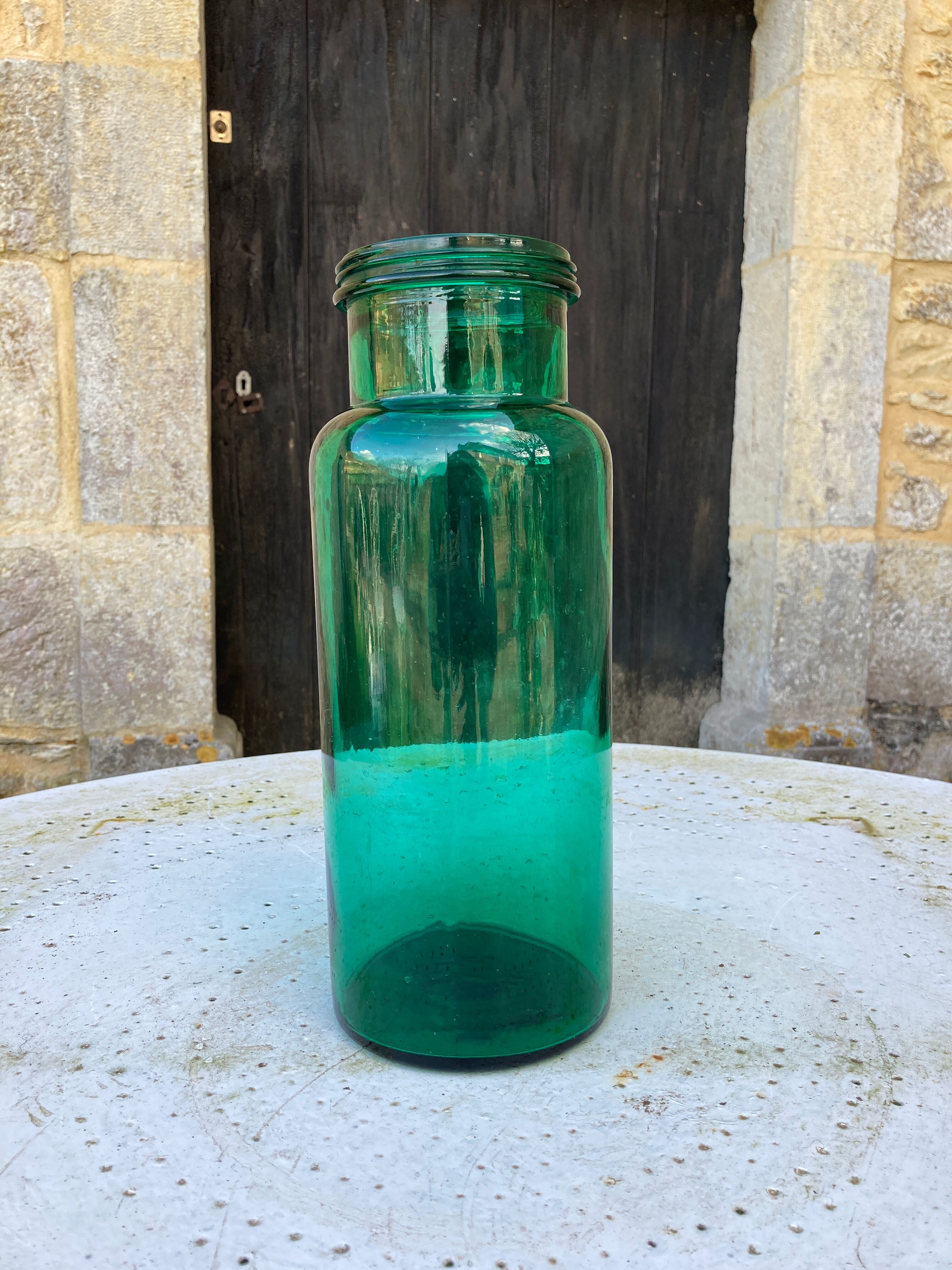 Large green glass jar