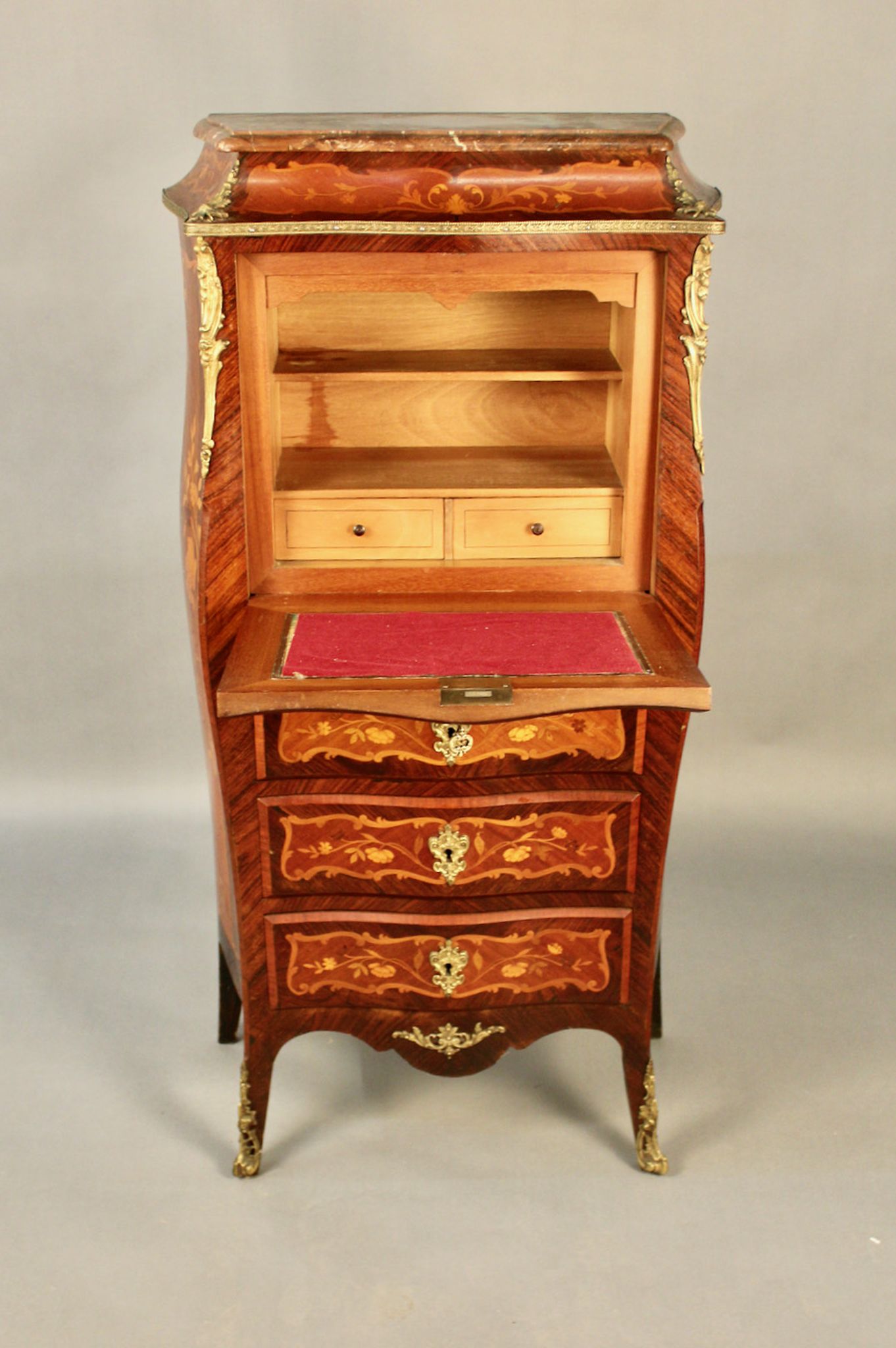 Secrétaire de dame marqueté galbé de style Louis XV