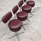 Set of 4 Mid Century Modern swivel chairs in tubular steel and leather.