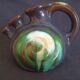 Vase with 3 flowers in the shape of a ceramic snail from Thulin (Belgium)