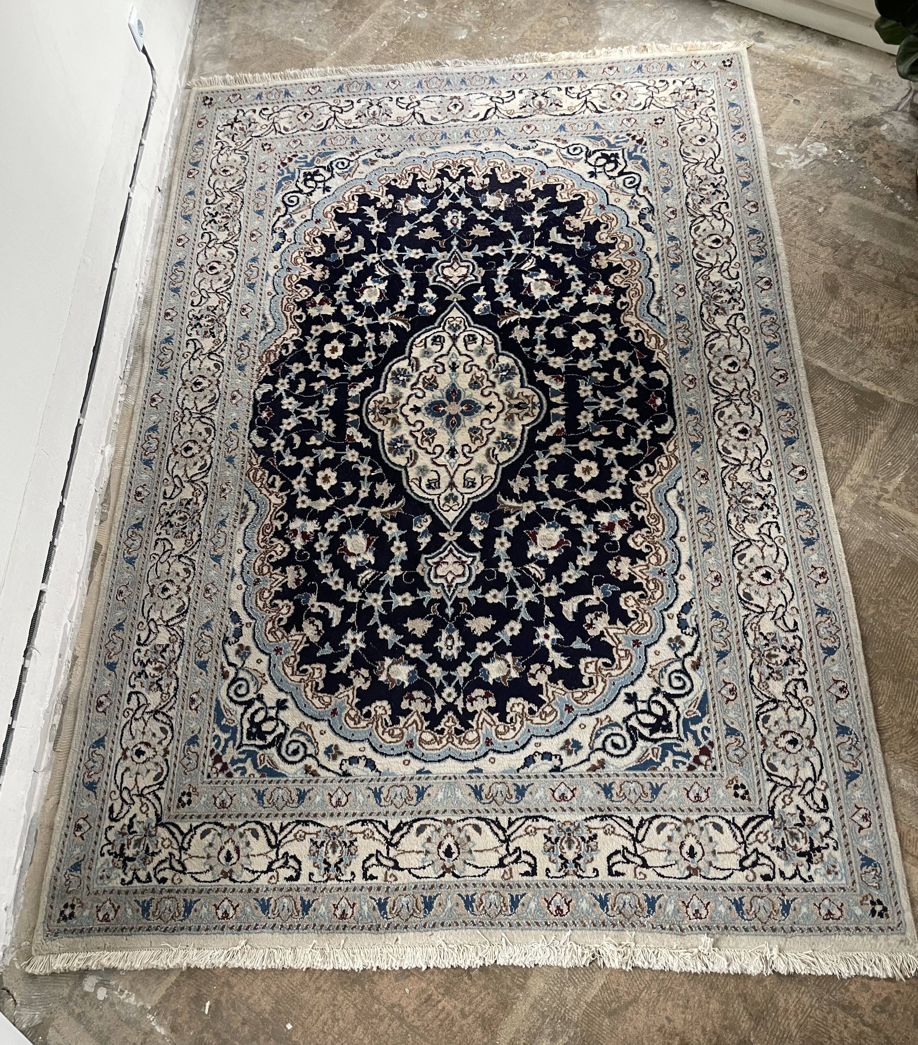 Hand-knotted Nain Persian rug with blue and white floral design