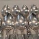 12 silver-plated dessert spoons with rocaille ribbon decoration, 18.5 cm