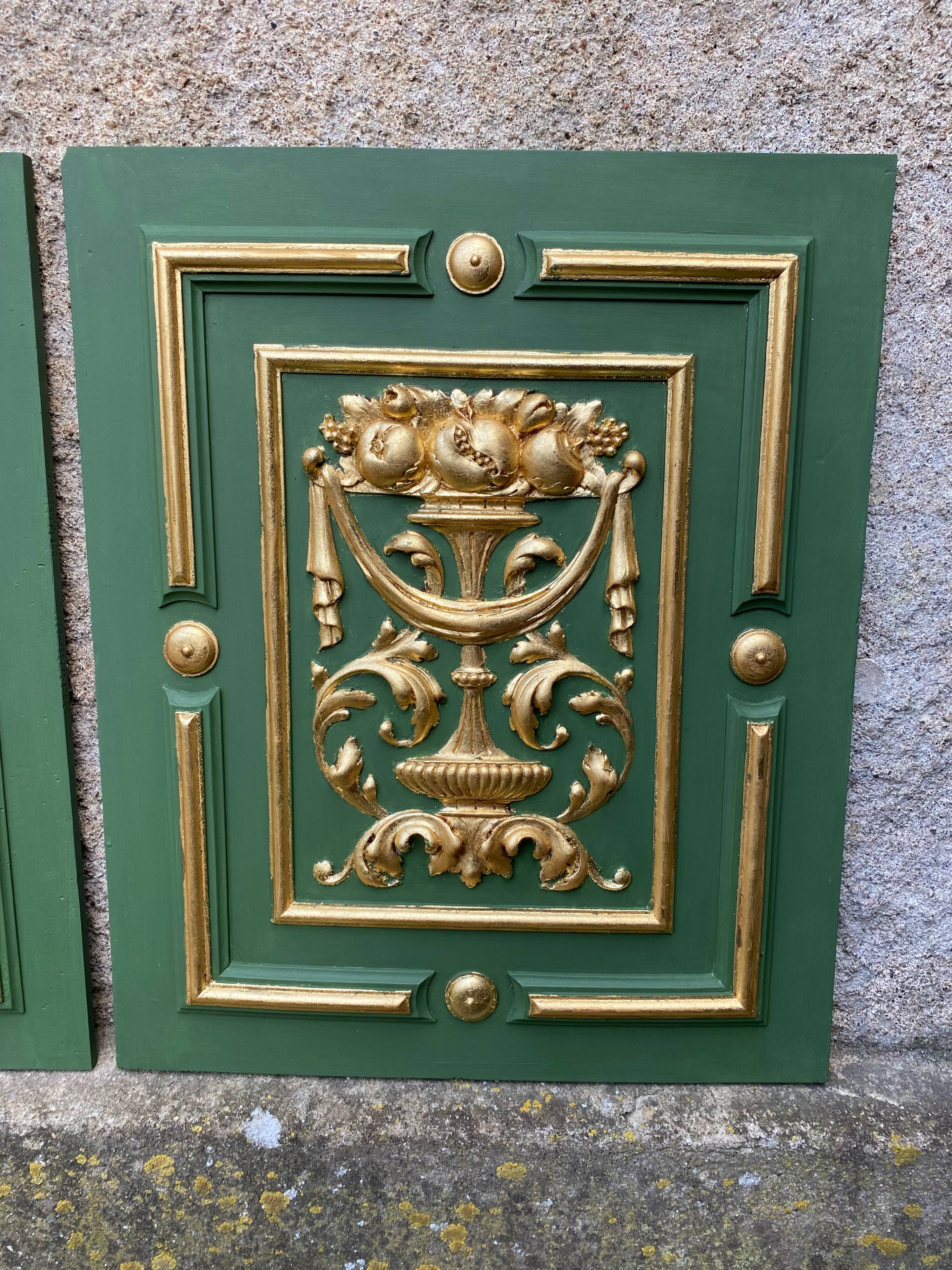 Pair of carved and leaf-gilded wooden panels