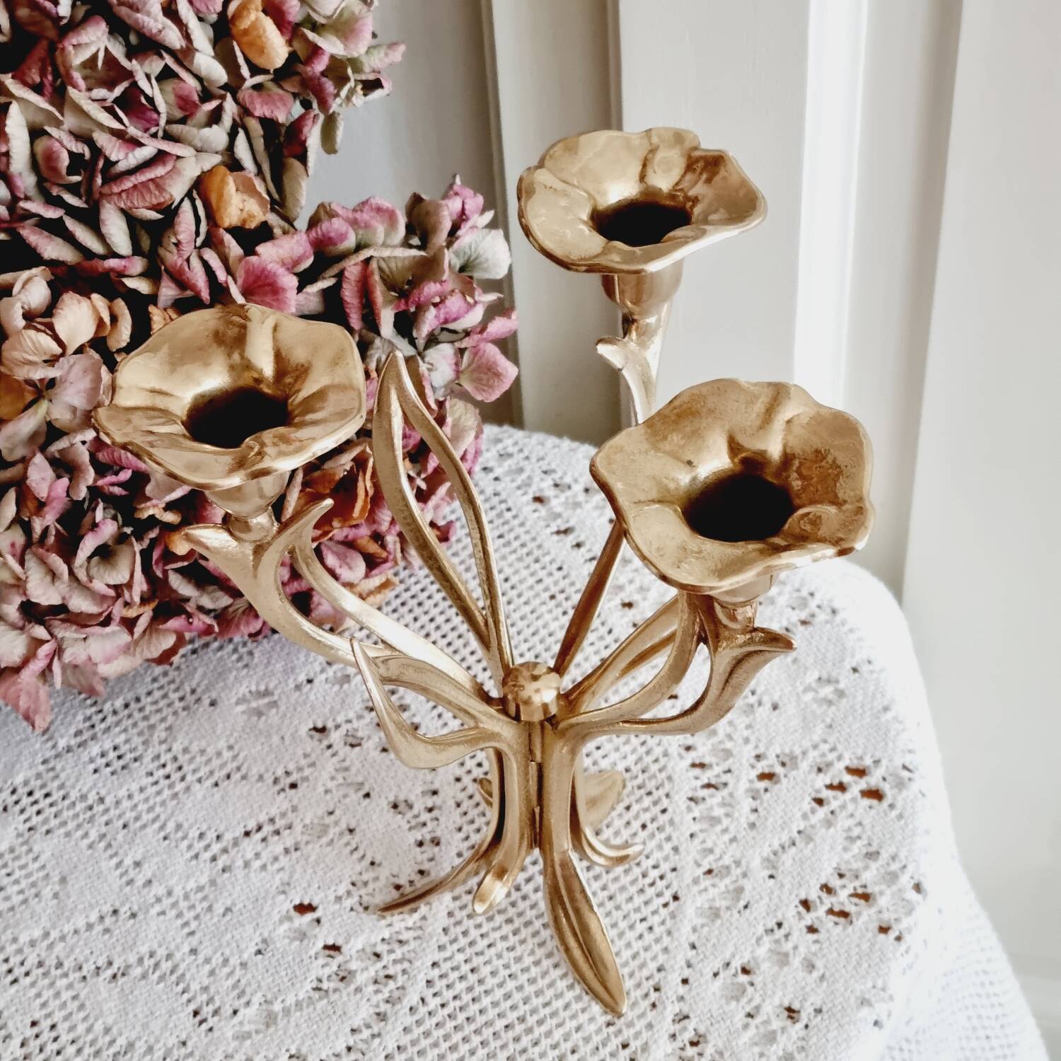 Tall brass flower candlestick