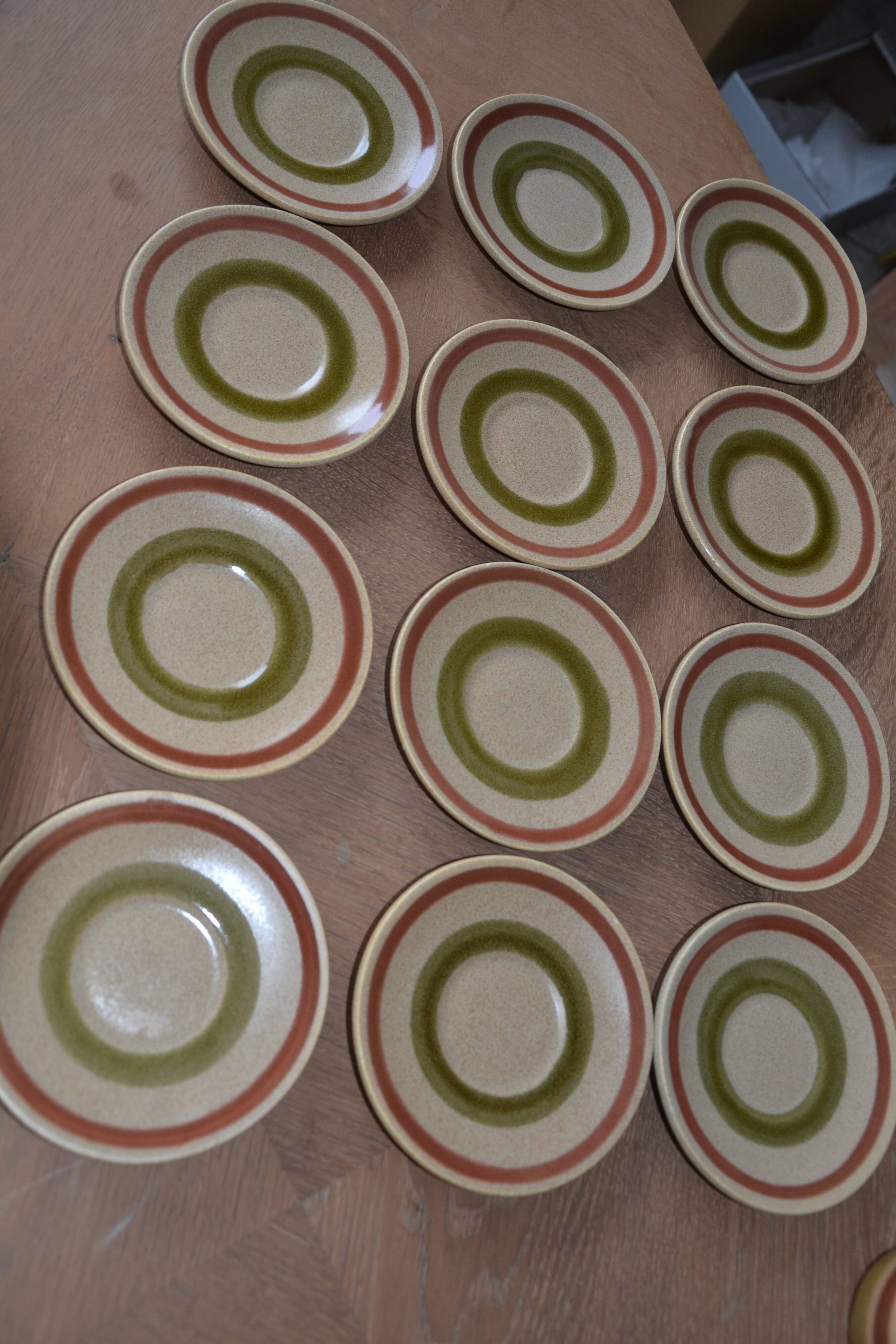11 St Amand glazed stoneware cups and saucers/sugar bowl/milk jug