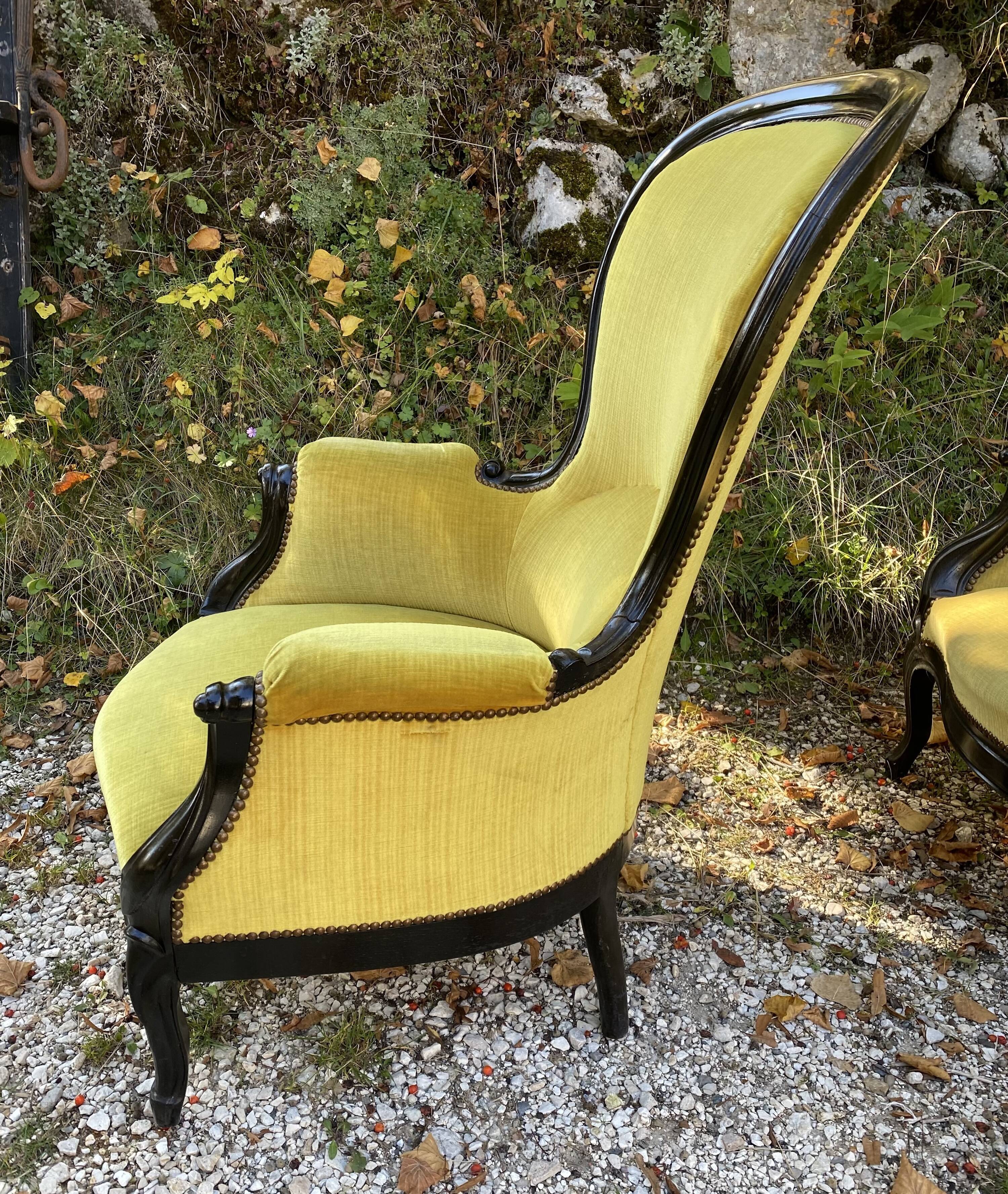 Pair of 19th century armchairs in black lacquered wood