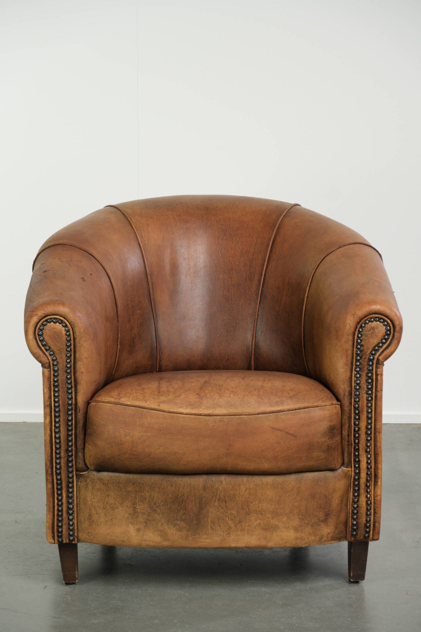 Vintage sheepskin clubchair in a beautiful cognac colour with a sturdy look