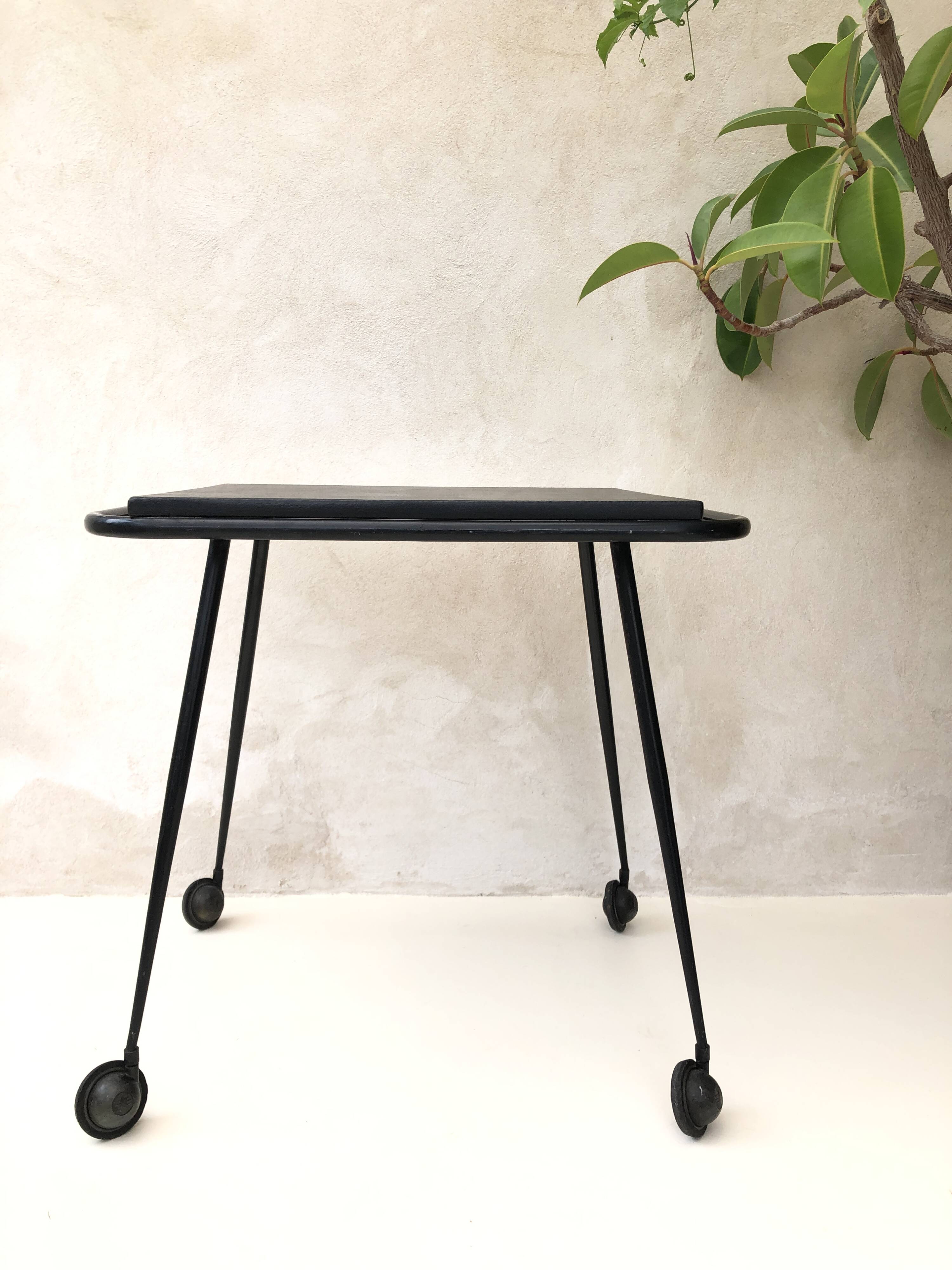 Black table on wheels from the 60s