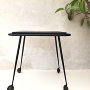Black table on wheels from the 60s