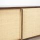 Sideboard in wenge, raffia and lacquered metal. 1970s.