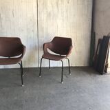 Set of 2 mid-century brown faux leather armchairs with black metal legs, 1960s.