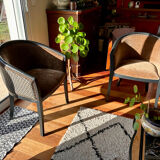 Pair of Art Deco barrel chairs in black and bronze