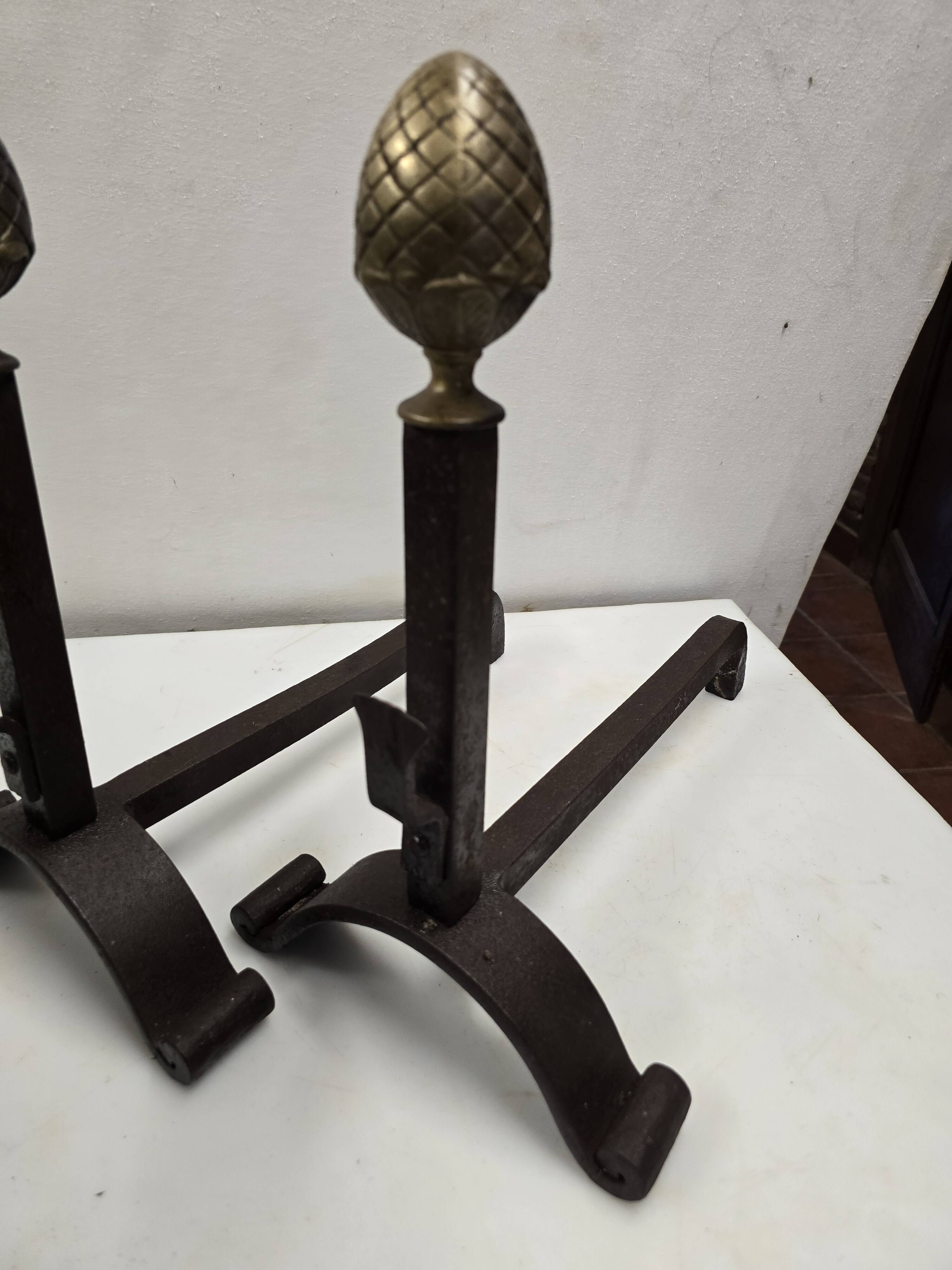 Old pair of wrought iron and bronze andirons