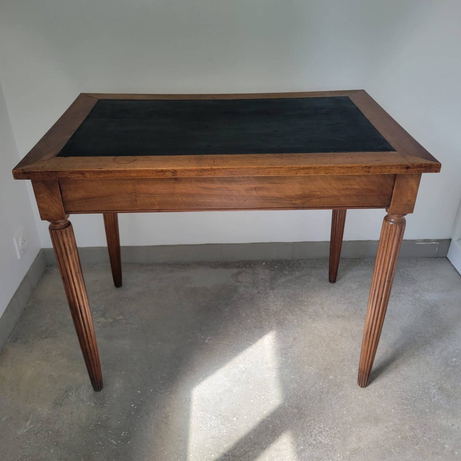 Antique desk made of solid wood and leather.
