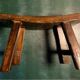 Antique milking stool in rustic curved wood, 19th century