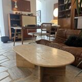 Oval coffee table in raw travertine