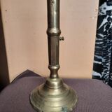 Golden candle holder with old pusher