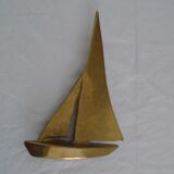 Stylized boat in brass decoration seaside