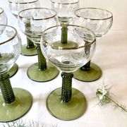 7 Alsace Roemer wine glasses, moss green stepped bases and gold trim.