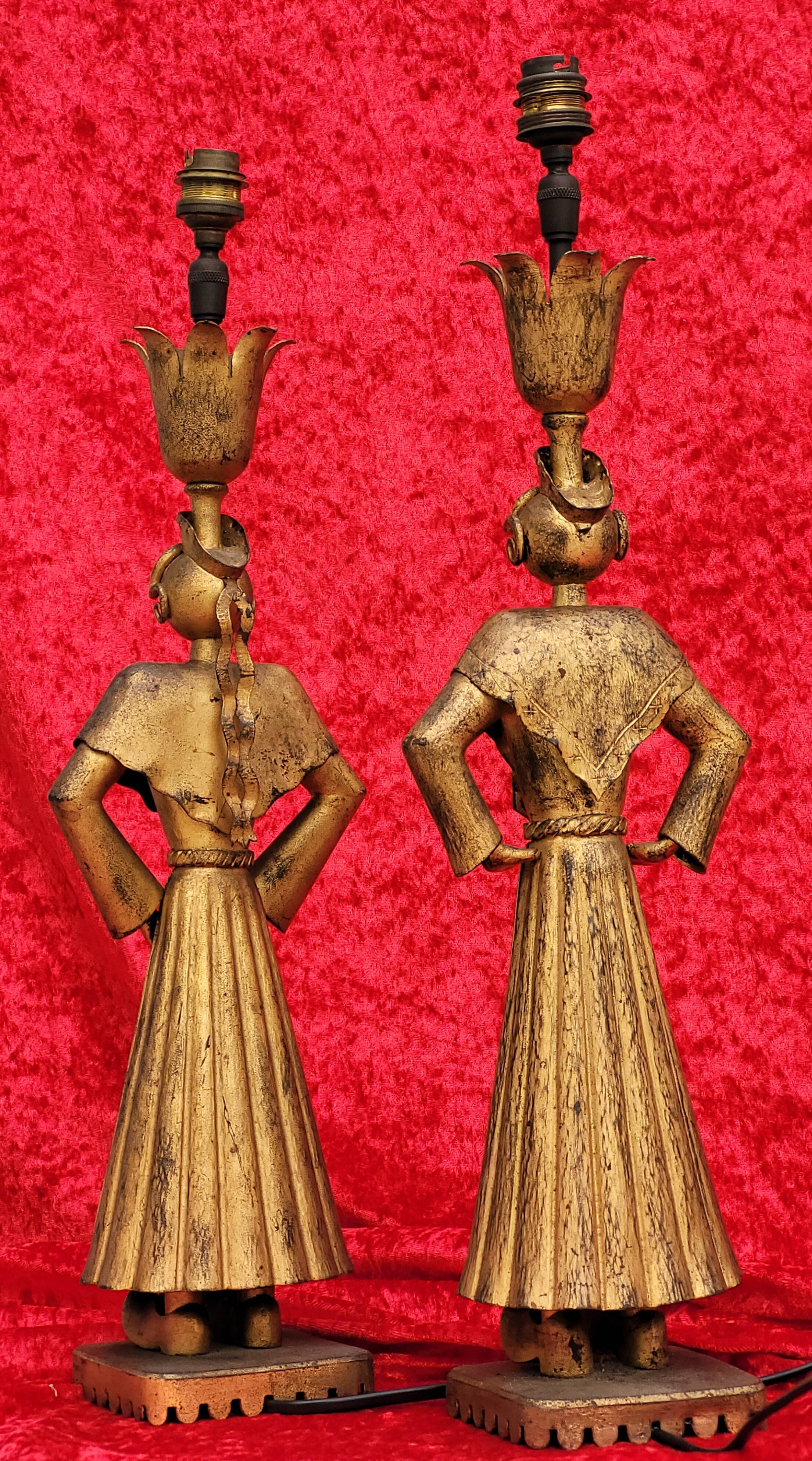 Pair of gilded beaten iron sculpture lamps attributed to Gilbert Poillerat