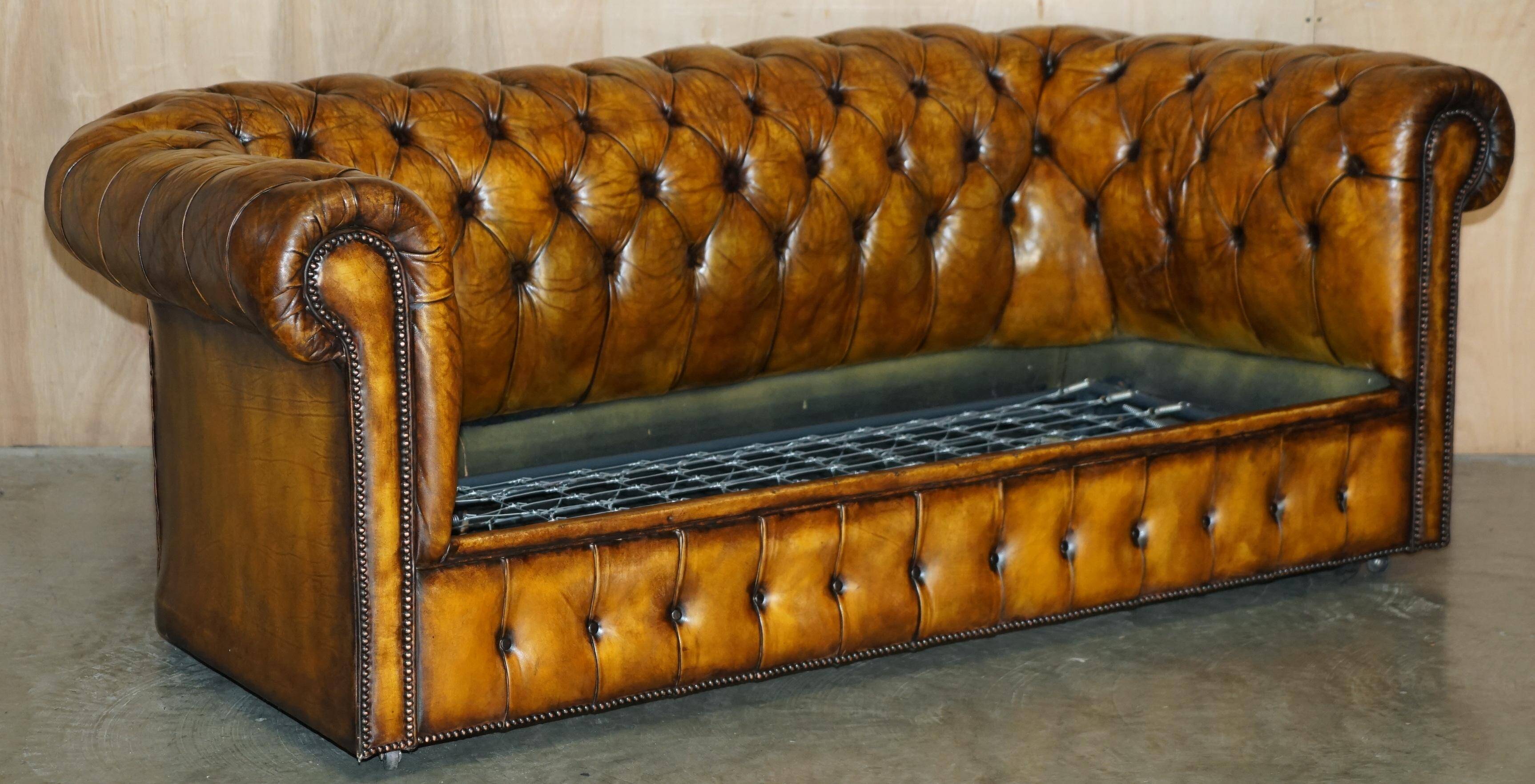 Vintage Chesterfield leather sofa bed, fully restored, circa 1940.
