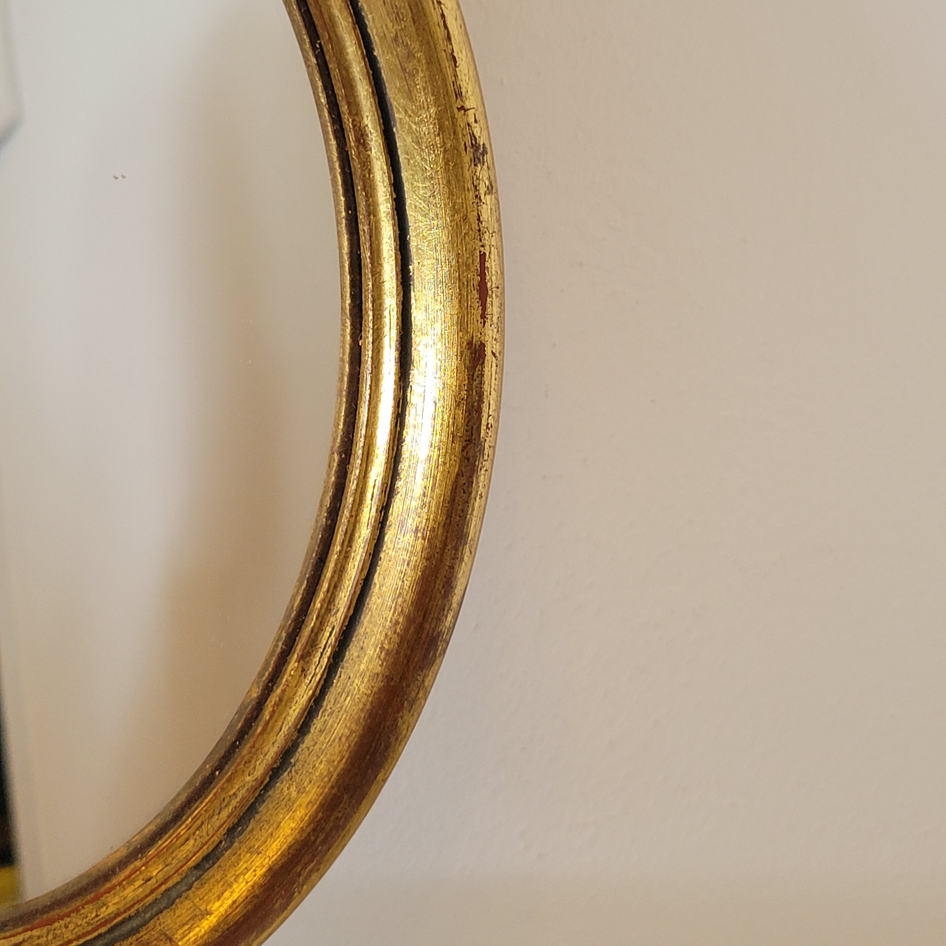 Old small oval mirror gilded wooden frame 22 X 17 X 2 cm.