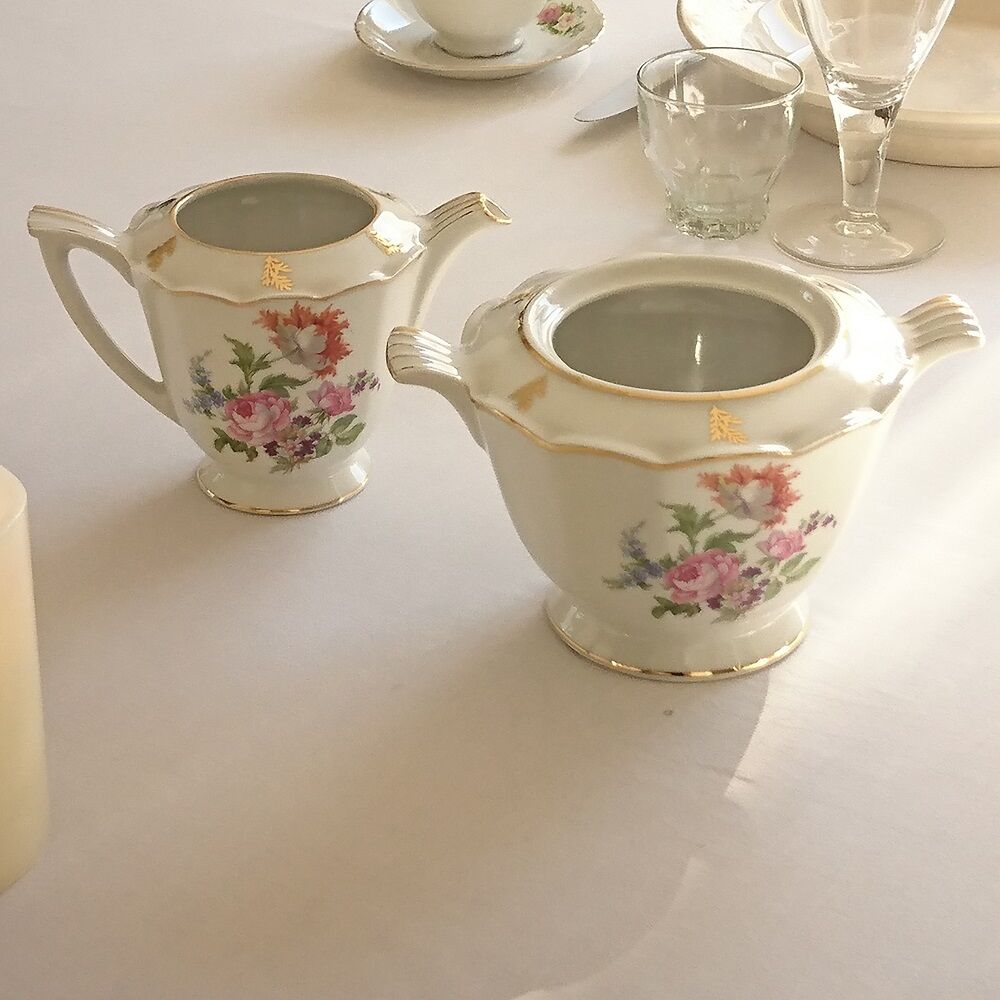 Sugar bowl and milk jar in flowery white porcelain