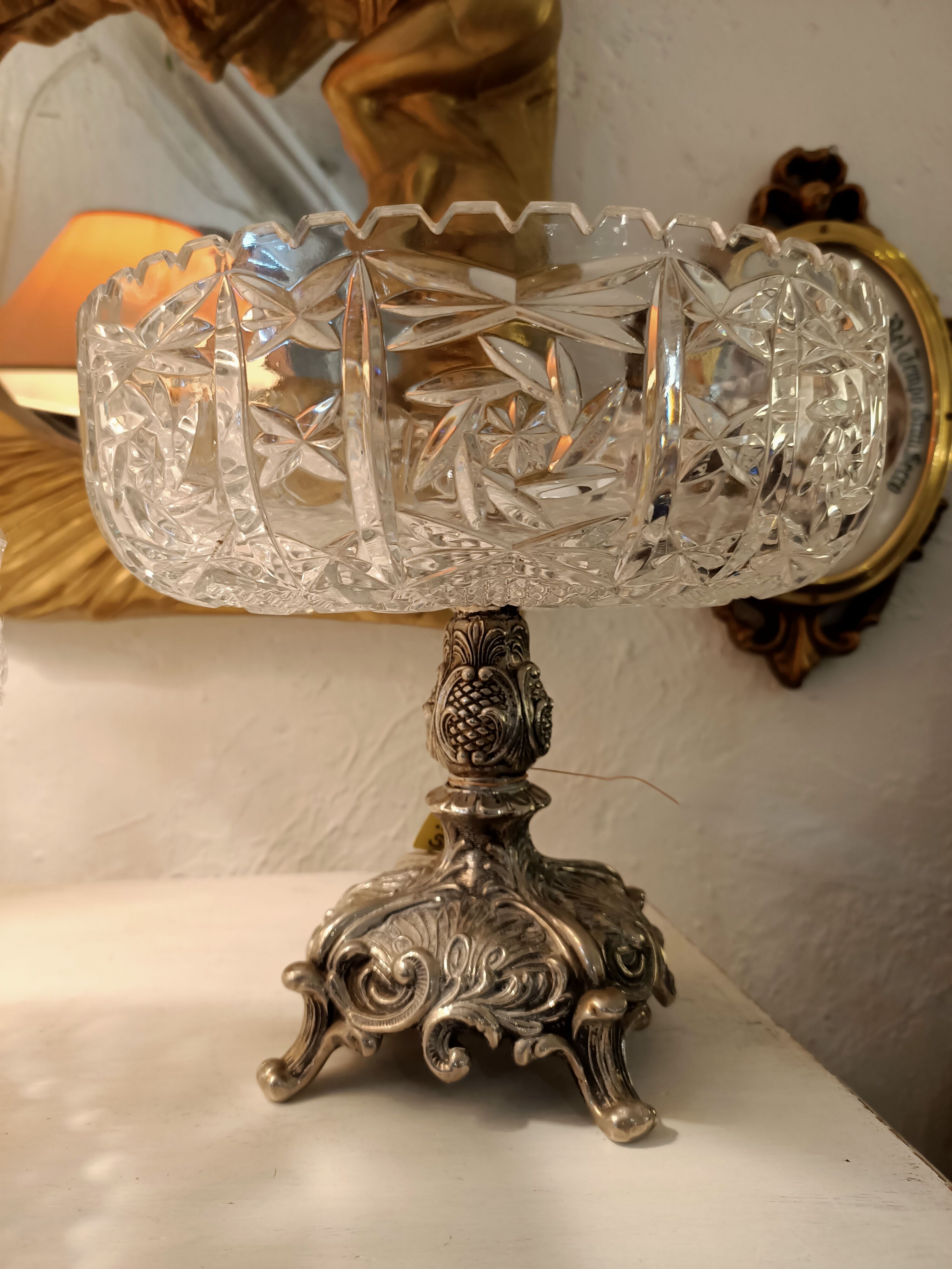 Crystal cut, silver metal.