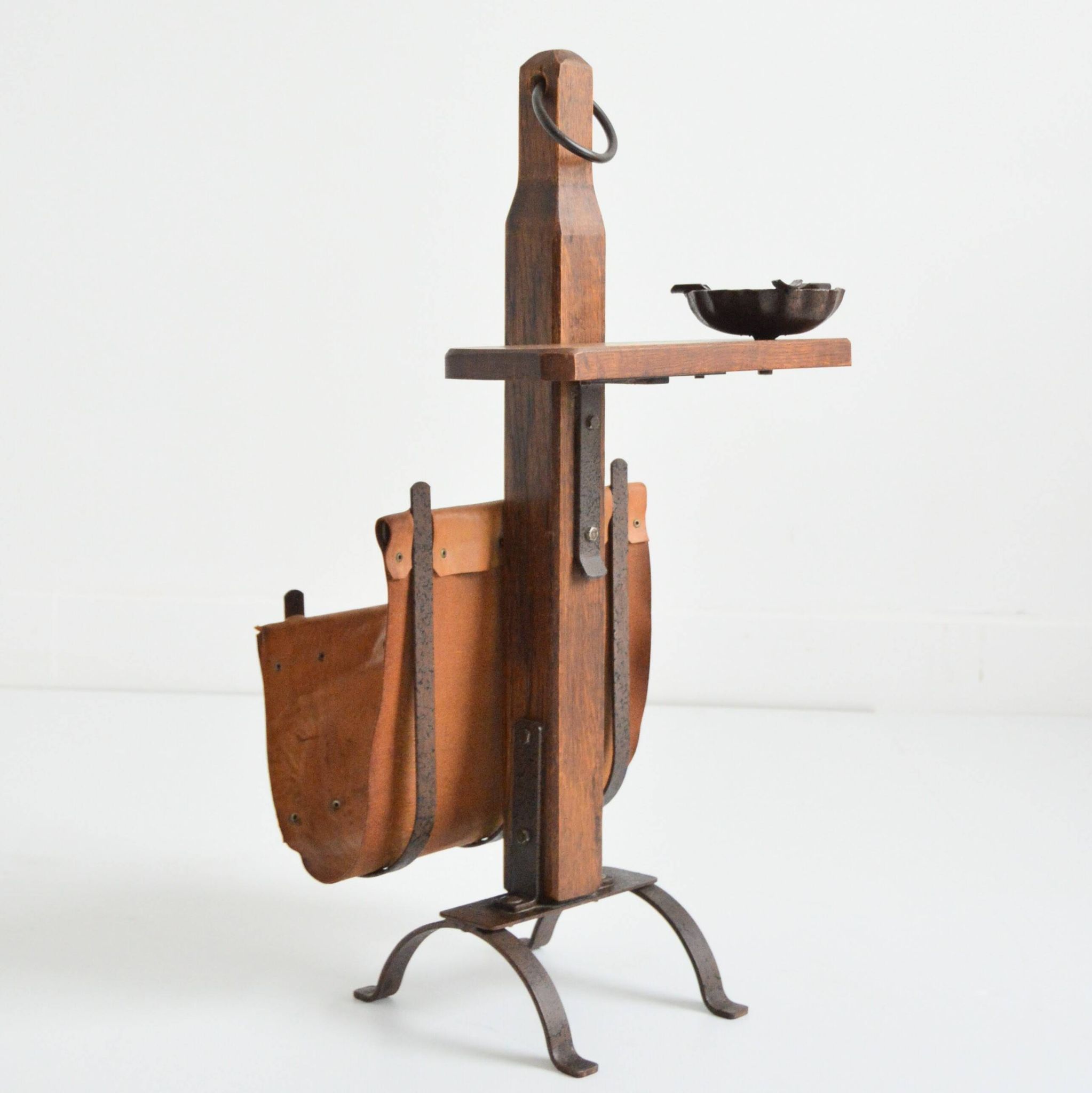 Vintage leather magazine rack with shelf and brutalist/rustic ashtray.