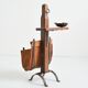 Vintage leather magazine rack with shelf and brutalist/rustic ashtray.