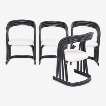 Set of four reupholstered dining chairs in organically formed black rattan