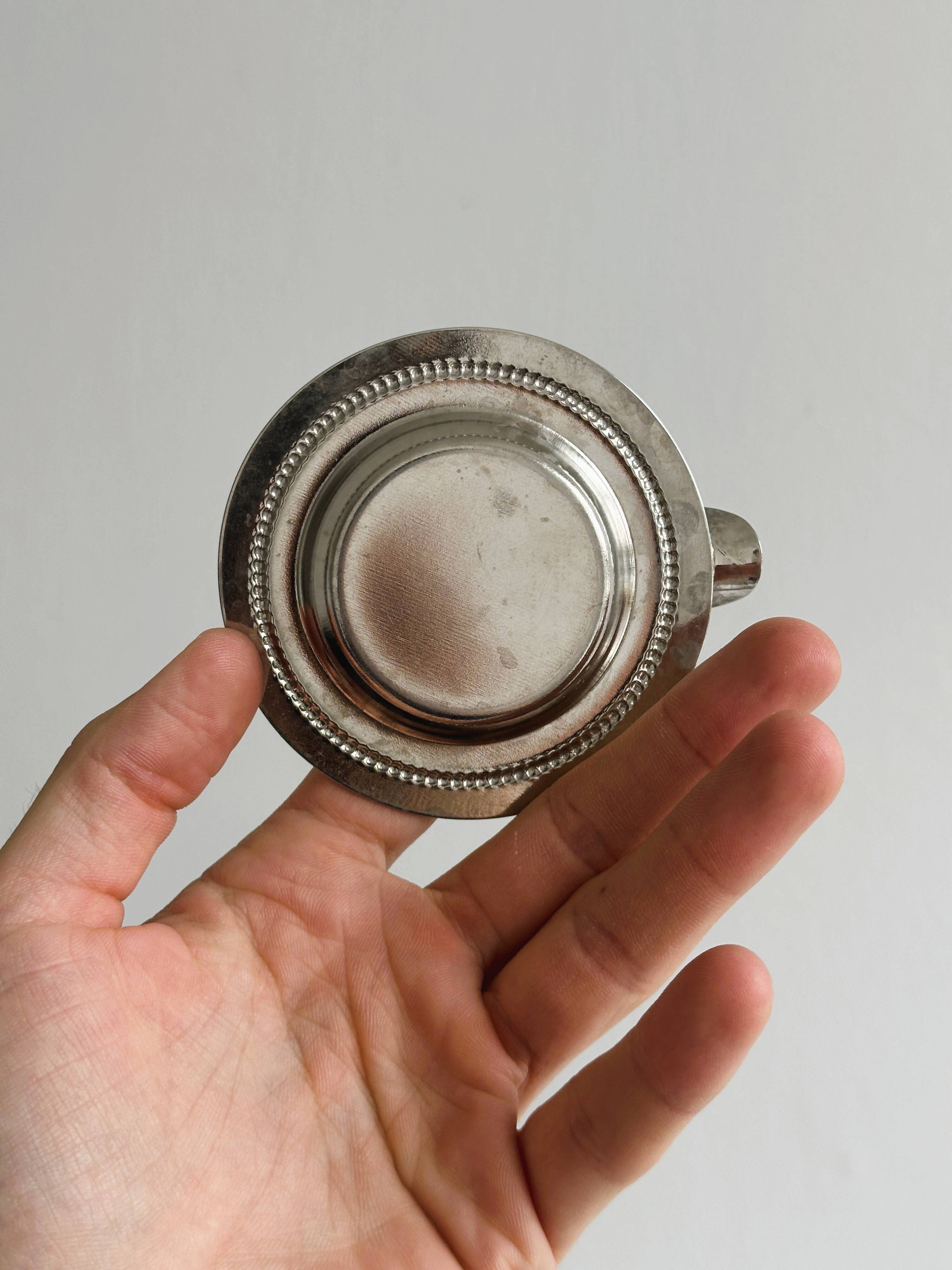 Small ashtray in shiny silver metal